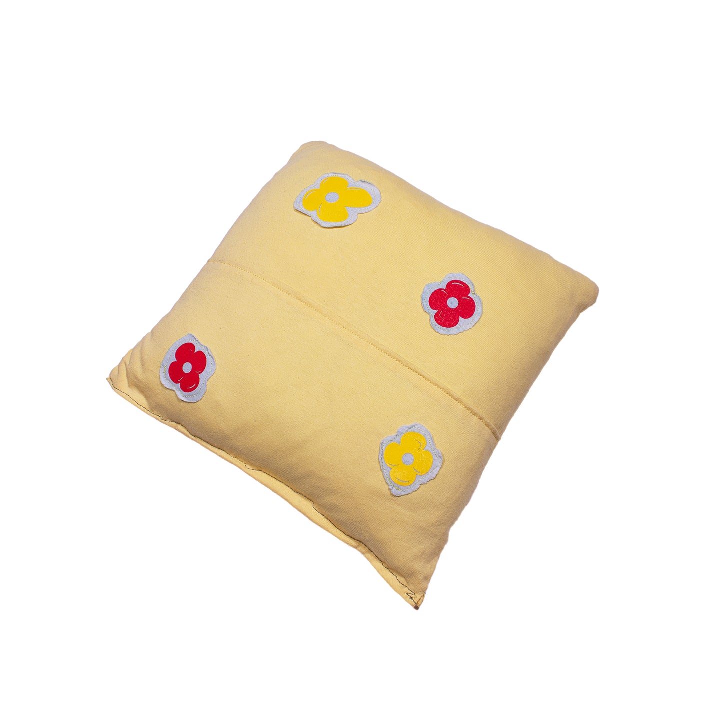 back of a yellow pillow with screen printed flowers