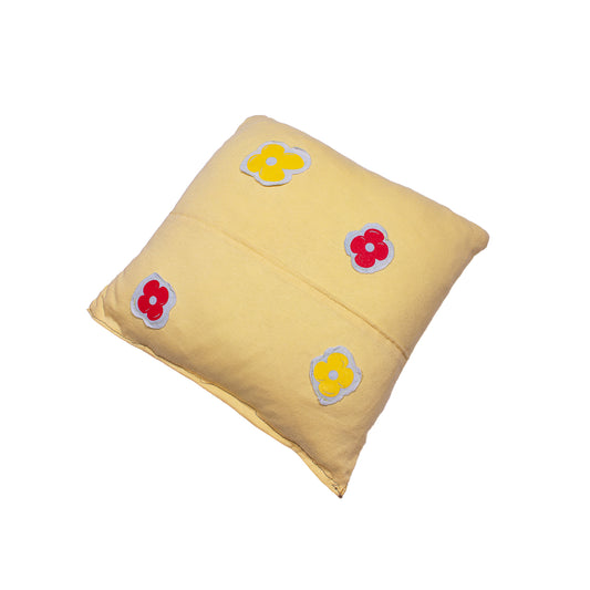 back of a yellow pillow with screen printed flowers