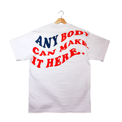 back of a t-shirt that says "anybody can make it here." in the silhouette of the American flag