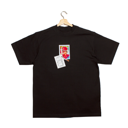 front of a t-shirt with a baseball card of Pete Rose along with a burning cigarette and a betting slip filled out by Pete Rose betting on the Cincinnati Reds 