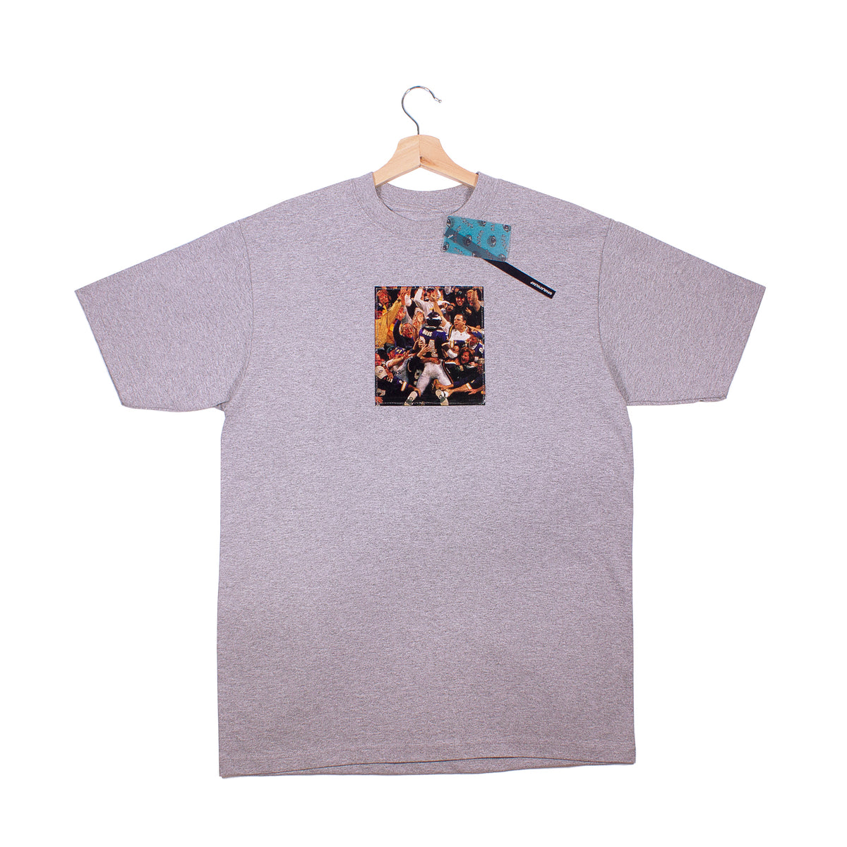 front of grey t-shirt with a vintage cut out photo of Randy Moss celebrating scoring a touchdown